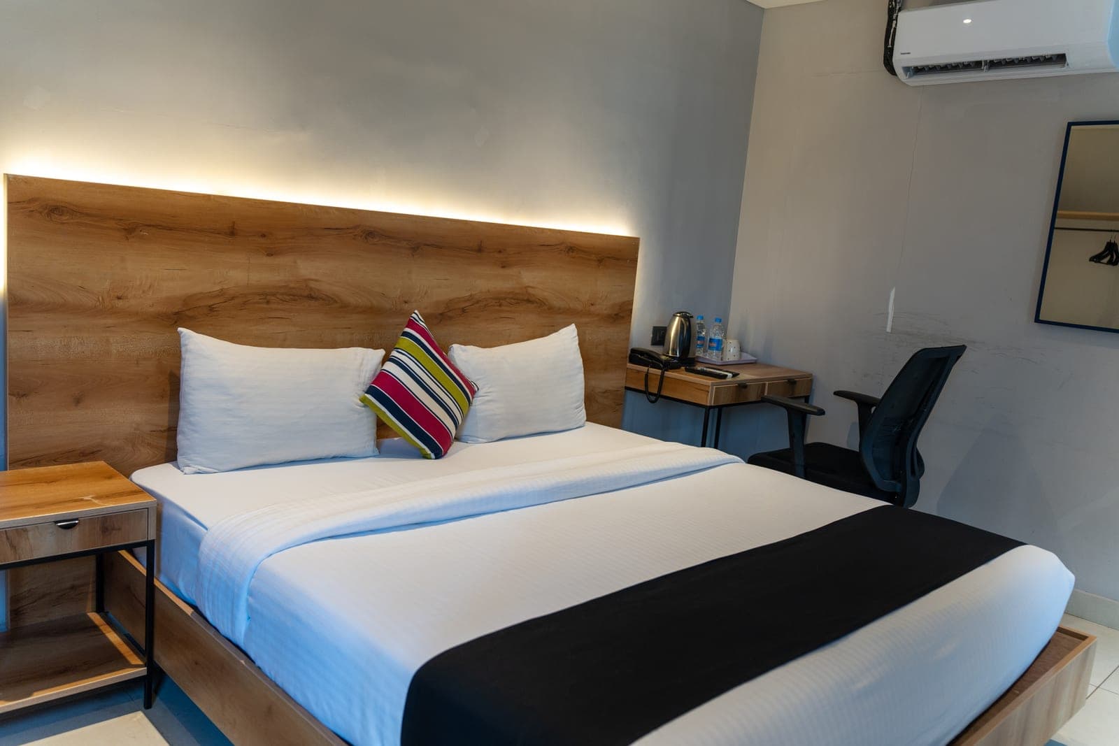 A room with a work desk, set up for business travel